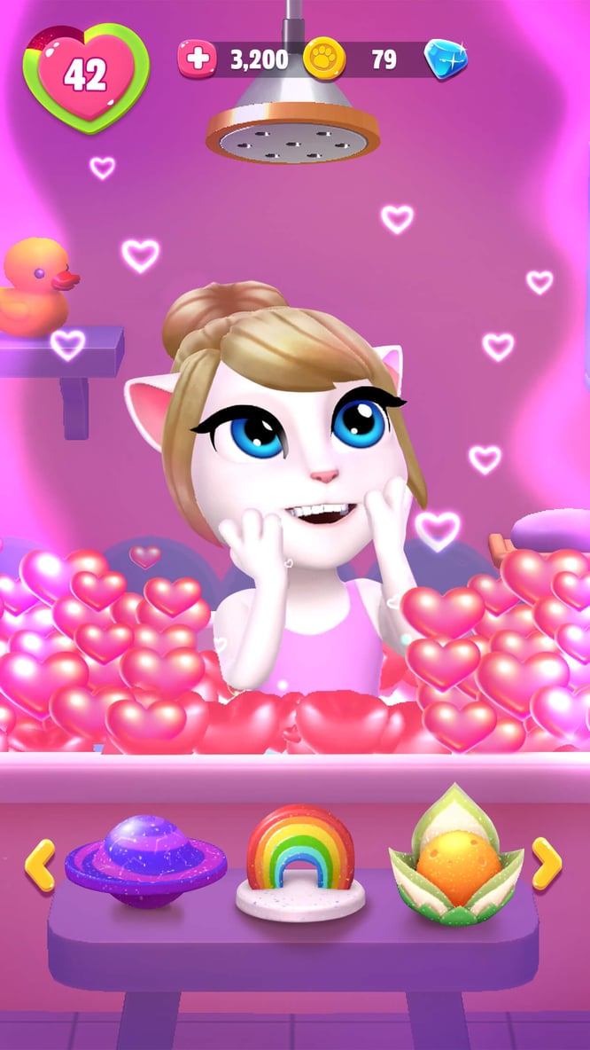 Talking Angela in a bath of heart bubbles inside of My Talking Angela 2 game.