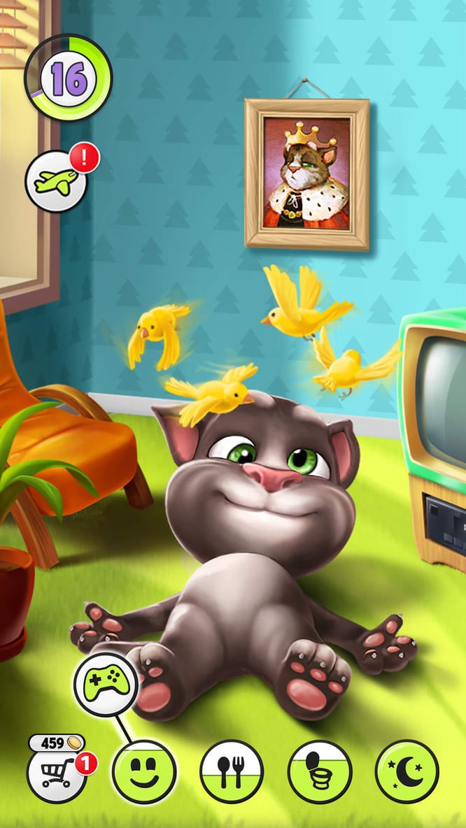 Talking Tom lying on the floor with birds spinning over his head in My Talking Tom game.