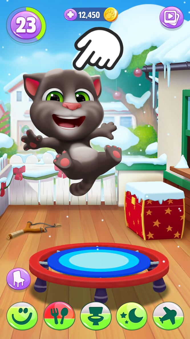 Talking Tom jumping on a trampoline inside of My Talking Tom 2 game.