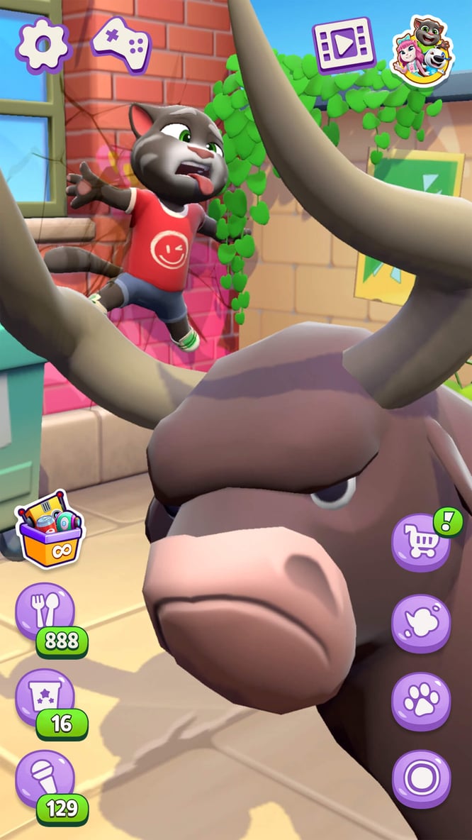 Talking Tom crashed by a bull inside of Talking Tom Cat game.