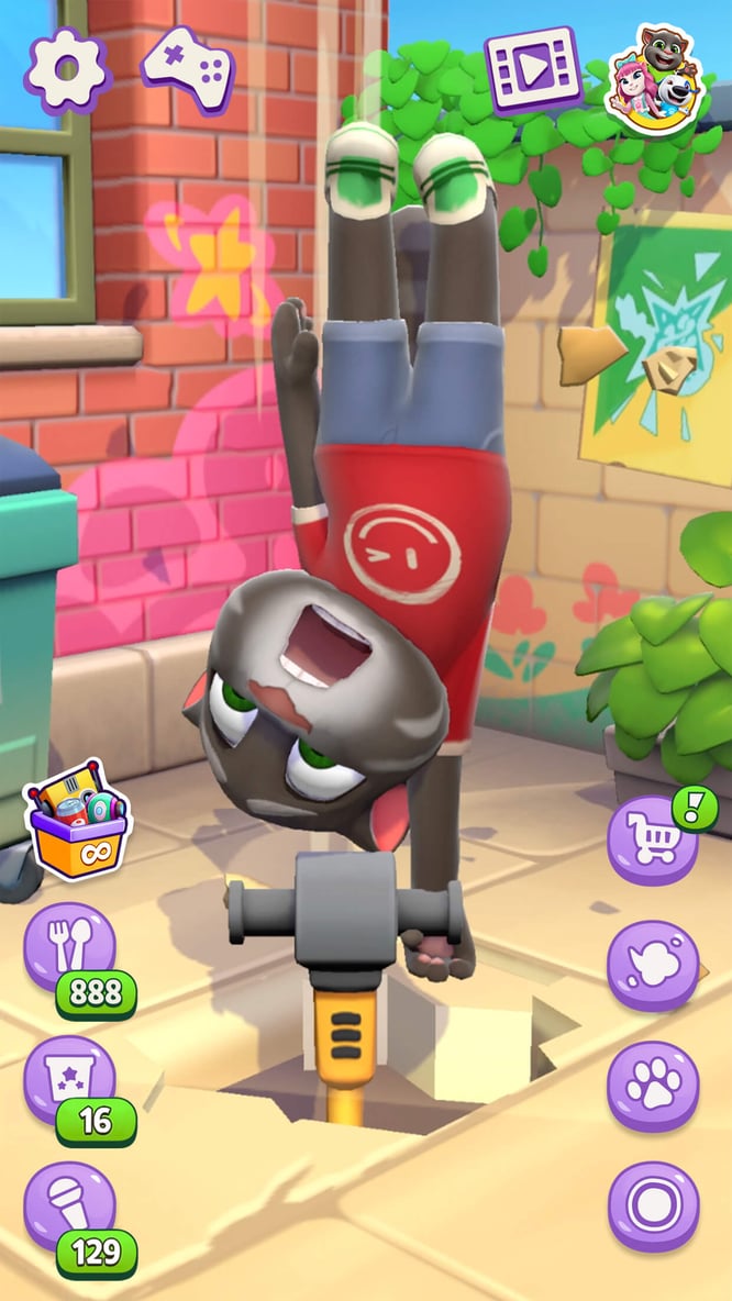 Talking Tom, upside down, drilling a hole through the ground with a jackhammer inside of Talking Tom Cat game.